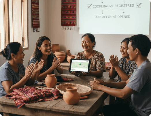 A group celebrates the registration of a VayaPin account using a digital tablet.